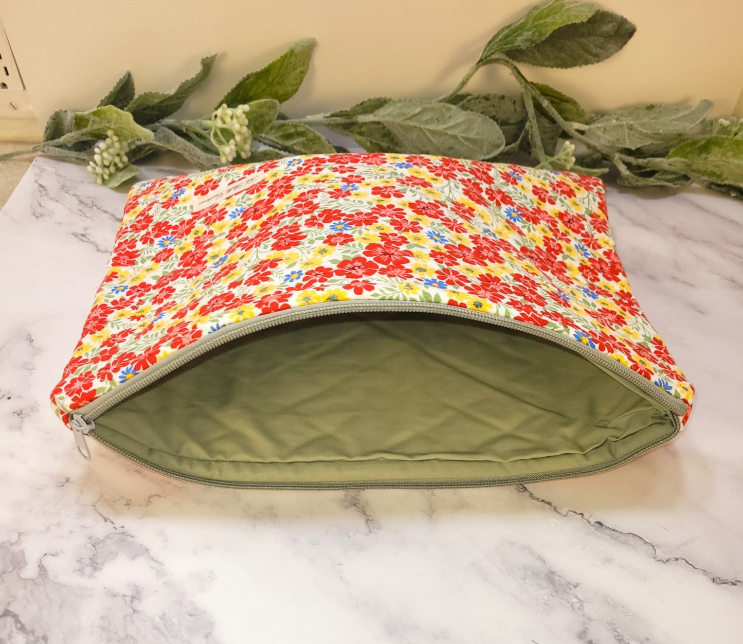 Primary Petals quilted protective sleeve. size M