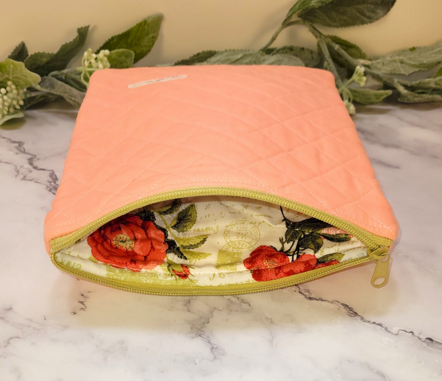 Peachy quilted protective sleeve. size S