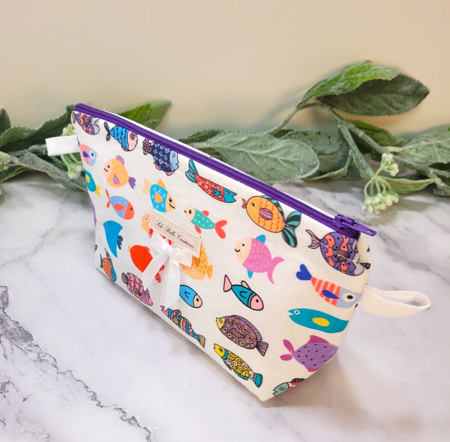 School of Fish makeup pouch, travel must-haves, cosmetic bag.