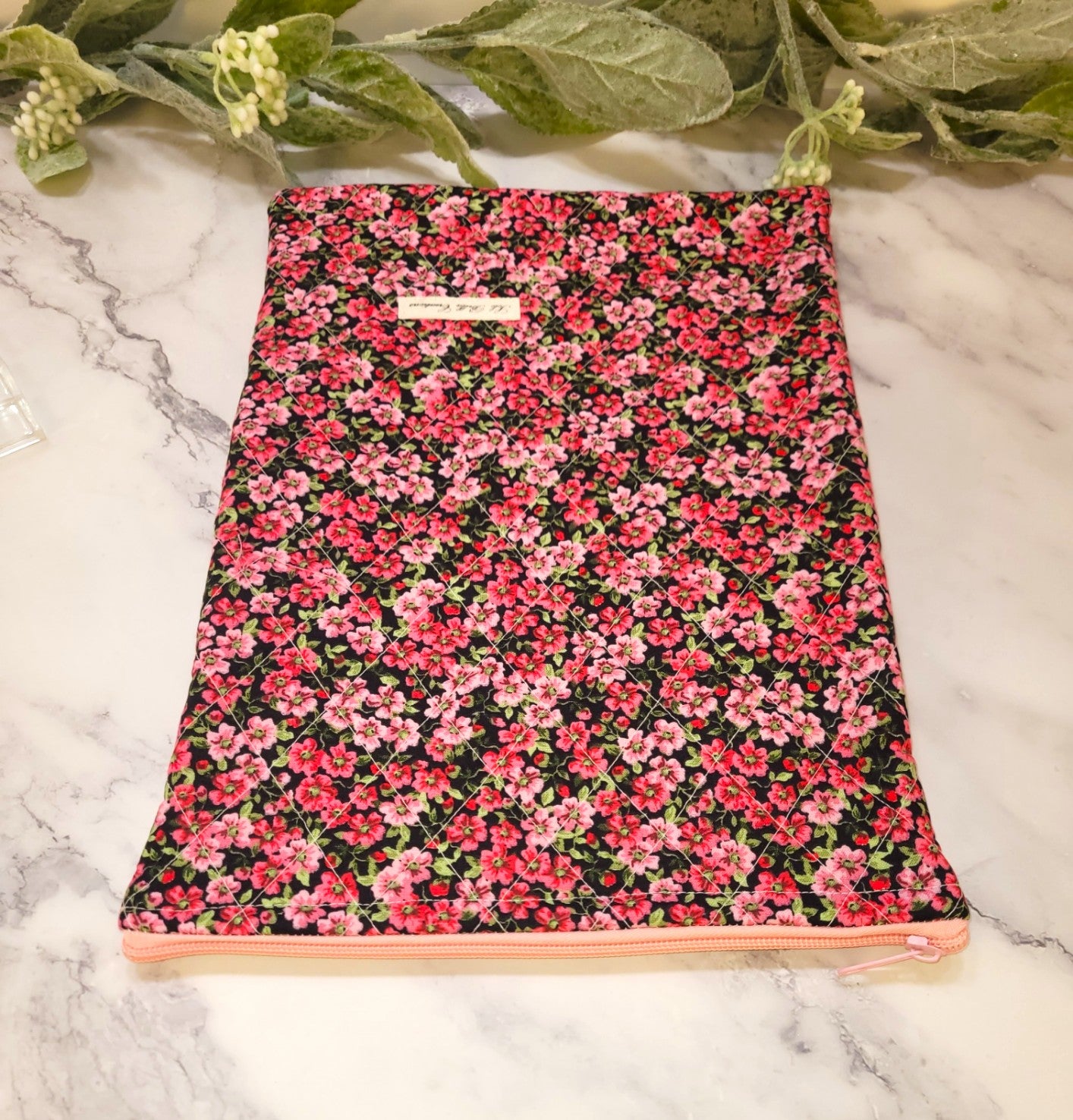 Pink Pansies quilted protective sleeve. size M