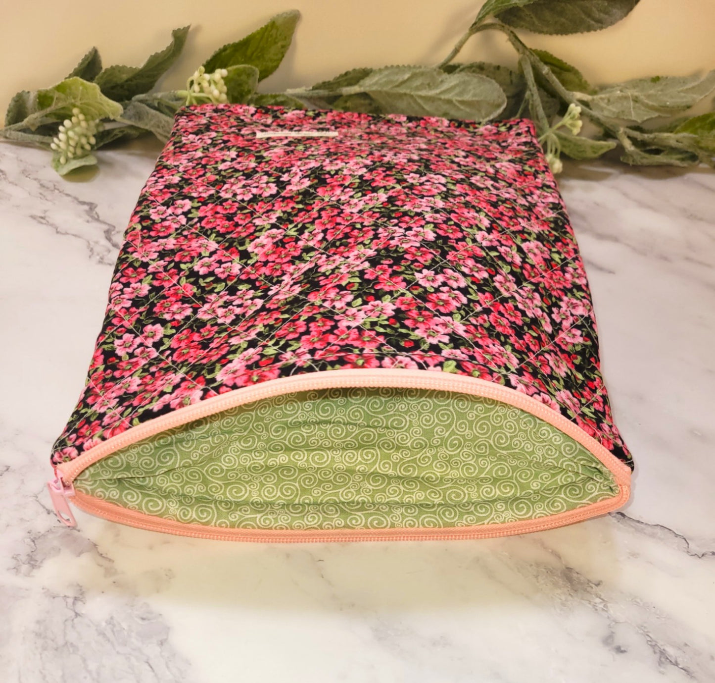 Pink Pansies quilted protective sleeve. size M