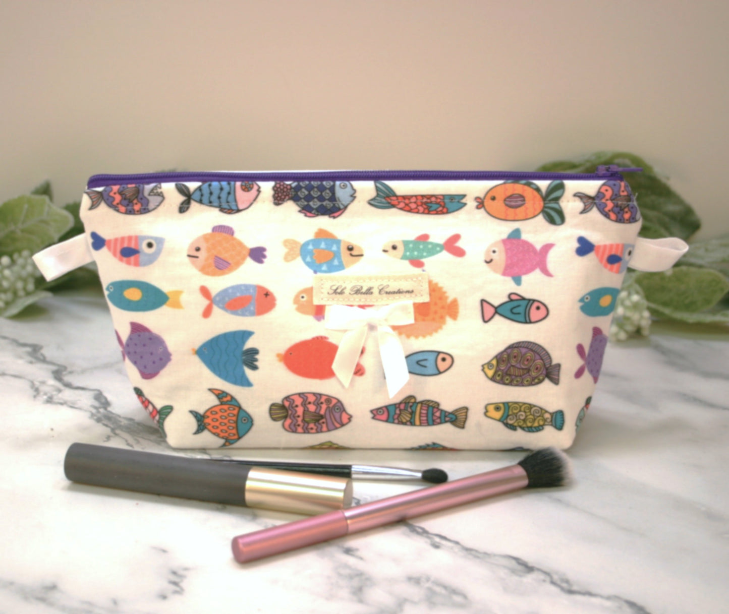 School of Fish makeup pouch, travel must-haves, cosmetic bag.