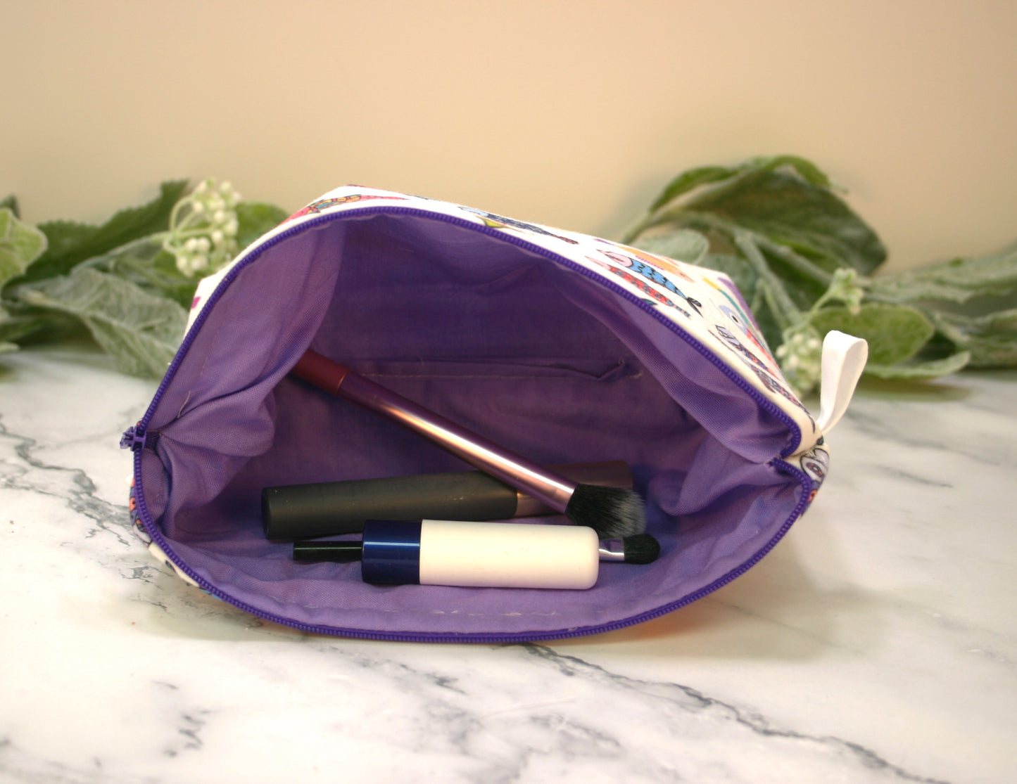 School of Fish makeup pouch, travel must-haves, cosmetic bag.